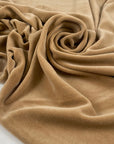 Very soft and stretchy chenille in cotton and polyamide, flowy and not transparent. In a camel color reference Latte. Ideal for dresses, trousers, skirts and also for jackets. High-quality deadstock collected in Stock from a Maison de Couture in Italy.