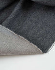 Dark gray colored heavy and falling cotton flannel. High-quality deadstock fabric collected in Stock from a Maison de Couture in Italy.