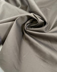 Double-face stretch cotton satin with brindle on one side and taupe gray on the other. Soft, elegant, and structured. Ideal for trousers, skirts, dresses, and light jackets.
High-quality deadstock collected in Stock from a Maison de Couture in Italy.