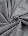 Grey cotton jersey, soft and stretchy. High-quality deadstock fabric collected in Stock from a Maison de Couture in Italy.