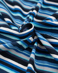 Cotton jersey with blue and white stripes blue background, soft and stretchy. Deadstock fabric picked up from a Maison de Couture in Italy.