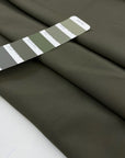 Stretch cotton cady in mud color, very soft and flowy, ideal for dresses, trousers, and elegant separates. High-quality deadstock collected in Stock from a Maison de Couture in Italy.