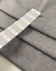 Stretch fabric with textured surface in light gray color reference Quiet Gray. Very soft and light, ideal for t-shirts and dresses. High-quality deadstock collected in Stock from a Maison de Couture in Italy.