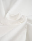 Lightweight and structured white cotton popeline. High-quality deadstock fabric collected in Stock from a Maison de Couture in Italy.