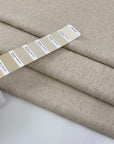 Mixed wool and cotton cream-colored, boucle fabric. It is heavy and falling. High-quality deadstock fabric collected in Stock from a Maison de Couture in Italy.