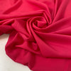 Fluorescent fuchsia polyester crêpe de chine with a fluid drape and matte texture ideal for bold blouses dresses and linings. High-quality deadstock collected in Stock from a Maison de Couture in Italy. Fluorescent fuchsia polyester crêpe de chine with a fluid drape and matte texture ideal for bold blouses dresses and linings. High-quality deadstock collected in Stock from a Maison de Couture in Italy.