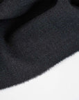 Dark gray stretch and structured wool crepe. High quality deadstock fabric.