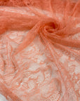 Very soft and light lace in peach color, polyester with beautiful floral design. High-quality deadstock fabric collected in Stock from a Maison de Couture in Italy.