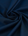 Fresh wool and polyester with blue and black wires. The fabric is soft and falling. High-quality deadstock collected in Stock from a Maison de Couture in Italy.