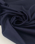 Very soft, medium-weight elasticized cotton in a rich midnight blue. Not transparent and ideal for structured yet comfortable garments. High-quality deadstock collected in Stock from a Maison de Couture in Italy.