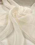 Very light pure white silk organza. It is very soft, flowing and transparent. High-quality deadstock fabric collected in Stock from a Maison de Couture in Italy.