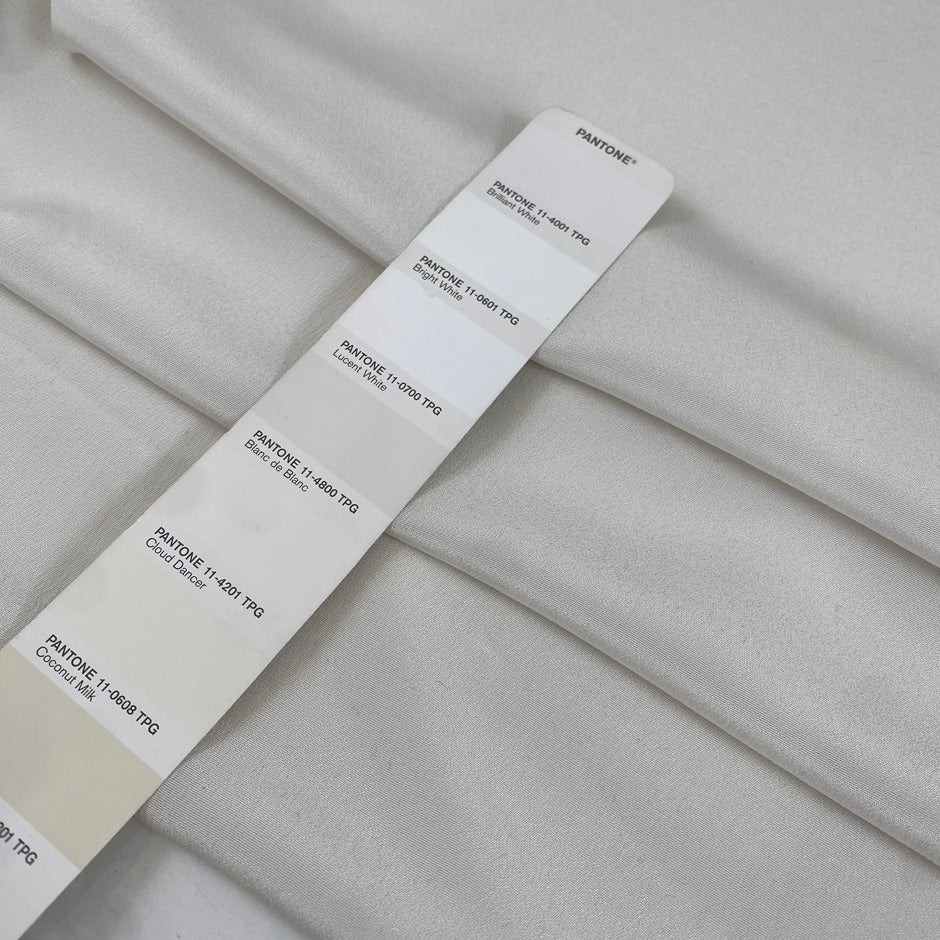 Pure heavy silk, crepe de chine in white. Very soft and light, a little transparent. High-quality deadstock fabric by the meter collected in Stock from a Maison de Couture in Italy.