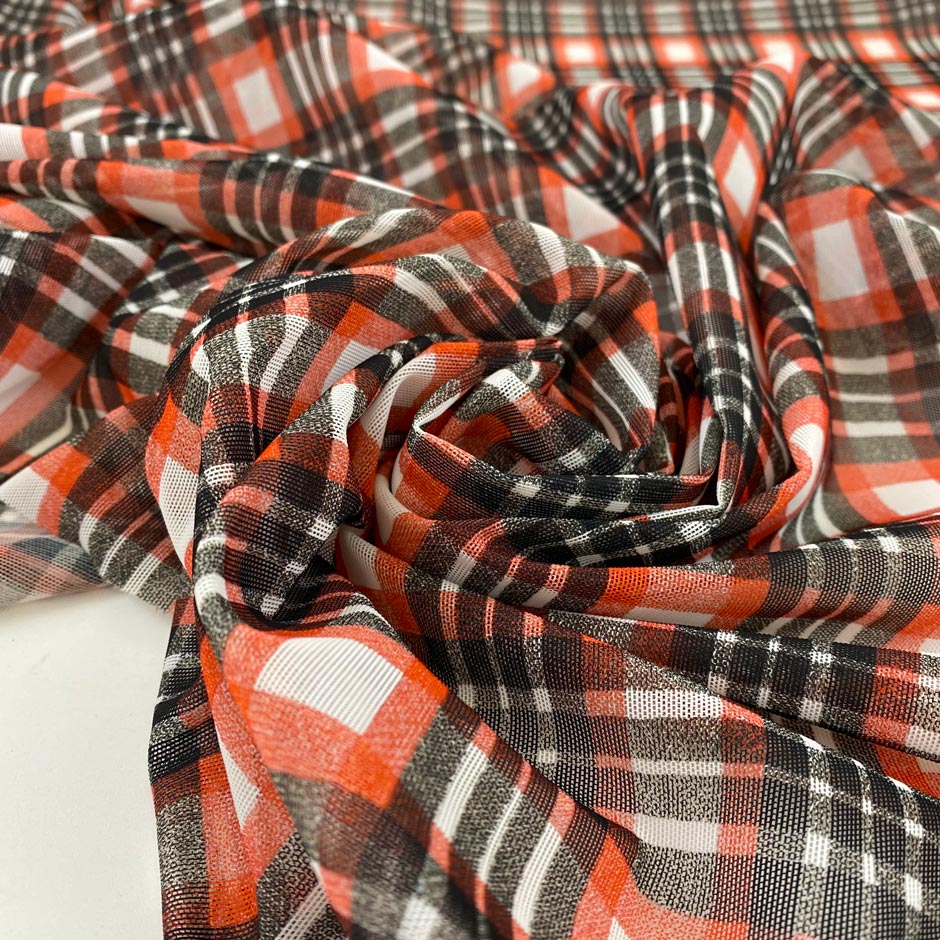 Stretch tulle with check design in white, red and black shades. A little stiff, very light and transparent. High-quality deadstock fabric by the meter collected in Stock from a Maison de Couture in Italy.
