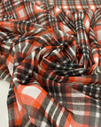 Stretch tulle with check design in white, red and black shades. A little stiff, very light and transparent. High-quality deadstock fabric by the meter collected in Stock from a Maison de Couture in Italy.