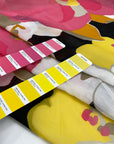 Cotton and silk chiffon with vast flower design in white, fuchsia, orange, yellow, and black shades. Very soft, light and transparent. High-quality deadstock fabric by the meter collected in Stock from a Maison de Couture in Italy.
