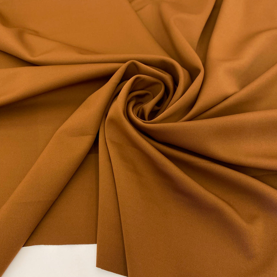 Polyester and Lycra double jersey in brown and black. Very soft and stretch, ideal for jackets and trousers. High-quality deadstock collected in Stock from a Maison de Couture in Italy.
