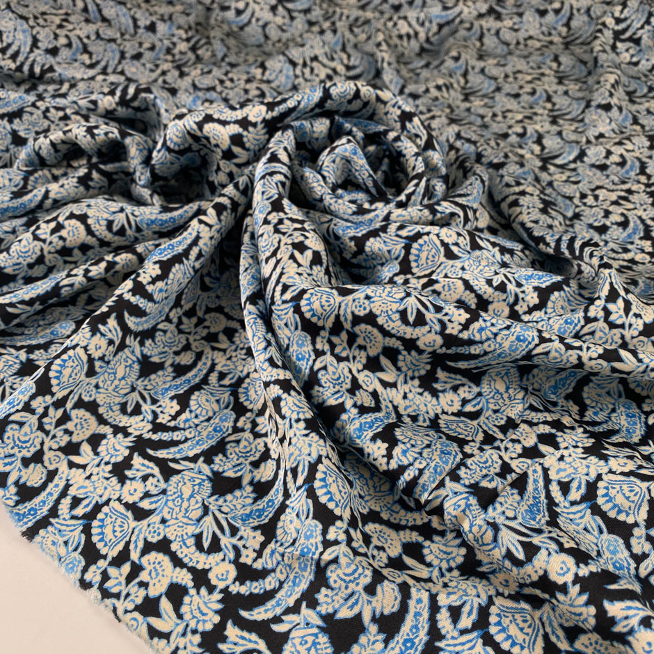 Pure soft viscose with dark blue base, white and light blue floral pattern. High-quality deadstock fabric collected in Stock from a Maison de Couture in Italy.