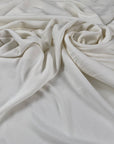 Viscose jersey with stretch in white color reference Snow White. Very soft and flowy, slightly shiny and not transparent. Ideal for dresses, linings, trousers, skirts, blouses and shirting. High-quality deadstock collected in Stock from a Maison de Couture in Italy.