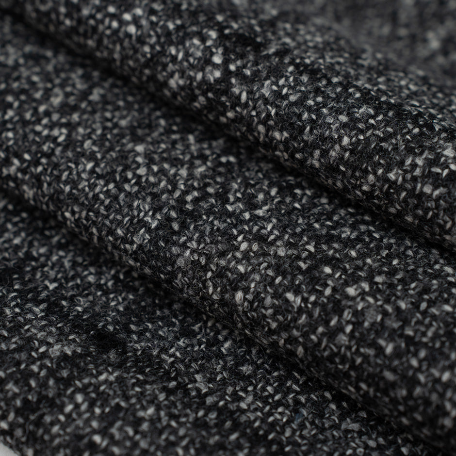 Mixed melange squared wool and nylon fabric. It is heavy and structured. High-quality deadstock fabric collected in Stock from a Maison de Couture in Italy.