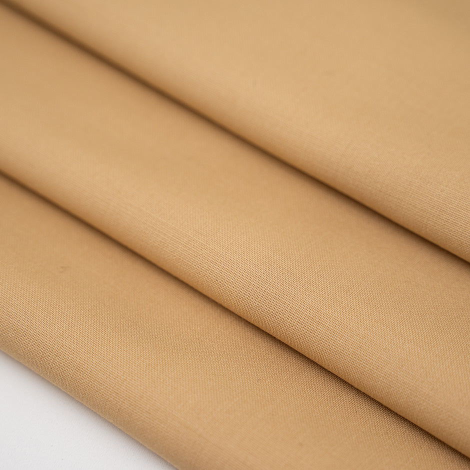 Wool and polyester elasticized camel color soft fabric. High-quality deadstock collected in Stock from a Maison de Couture in Italy.