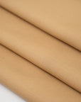 Wool and polyester elasticized camel color soft fabric. High-quality deadstock collected in Stock from a Maison de Couture in Italy.