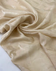 Silk jacquard in vanilla color, reference Alabaster Gleam. Very soft and light, flowy, ideal for dresses, skirts, blouses, and shirting. High-quality deadstock collected in Stock from a Maison de Couture in Italy.