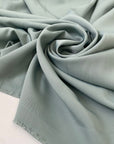 Polyester cady in sage color. Very soft, light, flowy, and not transparent. Ideal for trousers, dresses, and skirts. High-quality deadstock collected in Stock from a Maison de Couture in Italy.