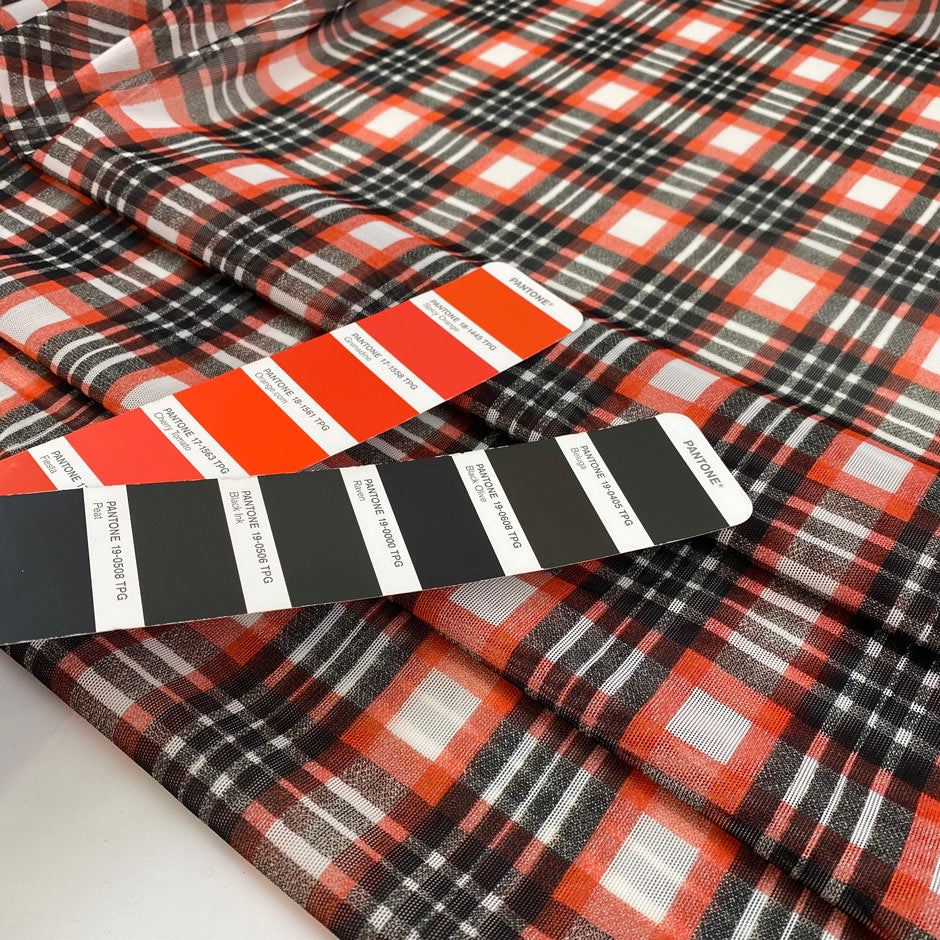 Stretch tulle with check design in white, red and black shades. A little stiff, very light and transparent. High-quality deadstock fabric by the meter collected in Stock from a Maison de Couture in Italy.