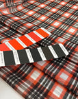 Stretch tulle with check design in white, red and black shades. A little stiff, very light and transparent. High-quality deadstock fabric by the meter collected in Stock from a Maison de Couture in Italy.