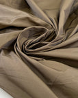 Polyester taffeta with a crunchy hand and opaque finish, ideal for structured garments, linings, and voluminous shapes. High-quality deadstock collected in Stock from a Maison de Couture in Italy.