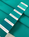 Flowy and soft cady in turquoise with a crepe texture. Made from polyester and elastane, ideal for dresses, trousers, skirts, and light jackets.High-quality deadstock collected in Stock from a Maison de Couture in Italy.