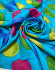Soft and lightweight pure viscose with a turquoise base and large multicolor polka dots. Flowy and not transparent, ideal for dresses, skirts, trousers, and blouses.High-quality deadstock collected in Stock from a Maison de Couture in Italy.
