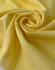Pure cotton in sun struck yellow, slightly heavy with a rough, linen-like texture. Perfect for dresses, jackets, or skirts. High-quality deadstock collected in Stock from a Maison de Couture in Italy.