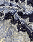 Polyester macramé lace with geometric pattern in light blue, gray, and dark blue. Light, detailed, and double scalloped. Ideal for dresses, skirts, shirting, or blouses. High-quality deadstock collected in Stock from a Maison de Couture in Italy.