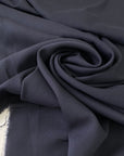 Soft and lightweight elasticized silk georgette in dark blue with slight transparency. Ideal for dresses, skirts, blouses, and shirting.
High-quality deadstock collected in Stock from a Maison de Couture in Italy.