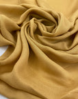 Soft pure viscose in spicy mustard color. Flowy and light, ideal for dresses, blouses and skirts. High-quality deadstock fabric by the meter collected in Stock from a Maison de Couture in Italy.