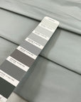 Cotton and polyester taffeta in Mirage Gray with a textured finish. Slightly stiff and shape-retaining, ideal for jackets, skirts, and dresses. High-quality deadstock collected in Stock from a Maison de Couture in Italy.