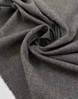 Blended wool and polyester in light gray melange. Very soft and lightweight, not transparent. Ideal for dresses, light jackets, skirts, and trousers. High-quality deadstock collected in Stock from a Maison de Couture in Italy.