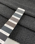 Wool and polyester tweed in smoked pearl grey. Very soft, flowy and medium weight. Ideal for light coats and jackets. High-quality deadstock collected in Stock from a Maison de Couture in Italy.