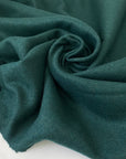 Heavy wool and polyester mix in dark green, shade Posy green. Very soft and warm, ideal for jackets and coats. High-quality deadstock collected in Stock from a Maison de Couture in Italy.