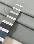 Polyester cady in sage color. Very soft, light, flowy, and not transparent. Ideal for trousers, dresses, and skirts. High-quality deadstock collected in Stock from a Maison de Couture in Italy.