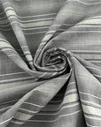 Gray striped cotton jacquard with an irregular pattern, soft and non-stretch. High-quality deadstock collected in Stock from a Maison de Couture in Italy.