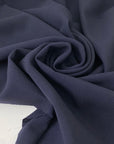 Heavy and flowing wool blend with stretch in dark blue. Ideal for structured yet elegant skirts, trousers, jackets, and dresses.High-quality deadstock collected in Stock from a Maison de Couture in Italy.