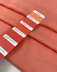 Pure viscose in peach color, very soft and light, flowy. Ideal for shirts, blouses, dresses, and skirts. High-quality deadstock fabric by the meter collected in Stock from a Maison de Couture in Italy