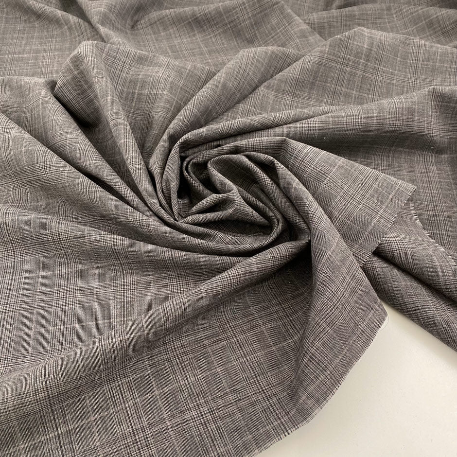 Textured wool cloth with Prince of Wales pattern in gray and purple. High quality deadstock fabric.