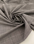 Textured wool cloth with Prince of Wales pattern in gray and purple. High quality deadstock fabric.
