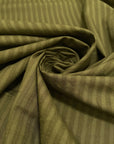 Pure cotton jacquard in avocado green with refined stripe design. Versatile and elegant, ideal for dresses, skirts, and trousers. High-quality deadstock collected in Stock from a Maison de Couture in Italy.