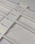 Viscose jersey with stretch in white color reference Snow White. Very soft and flowy, slightly shiny and not transparent. Ideal for dresses, linings, trousers, skirts, blouses and shirting. High-quality deadstock collected in Stock from a Maison de Couture in Italy.