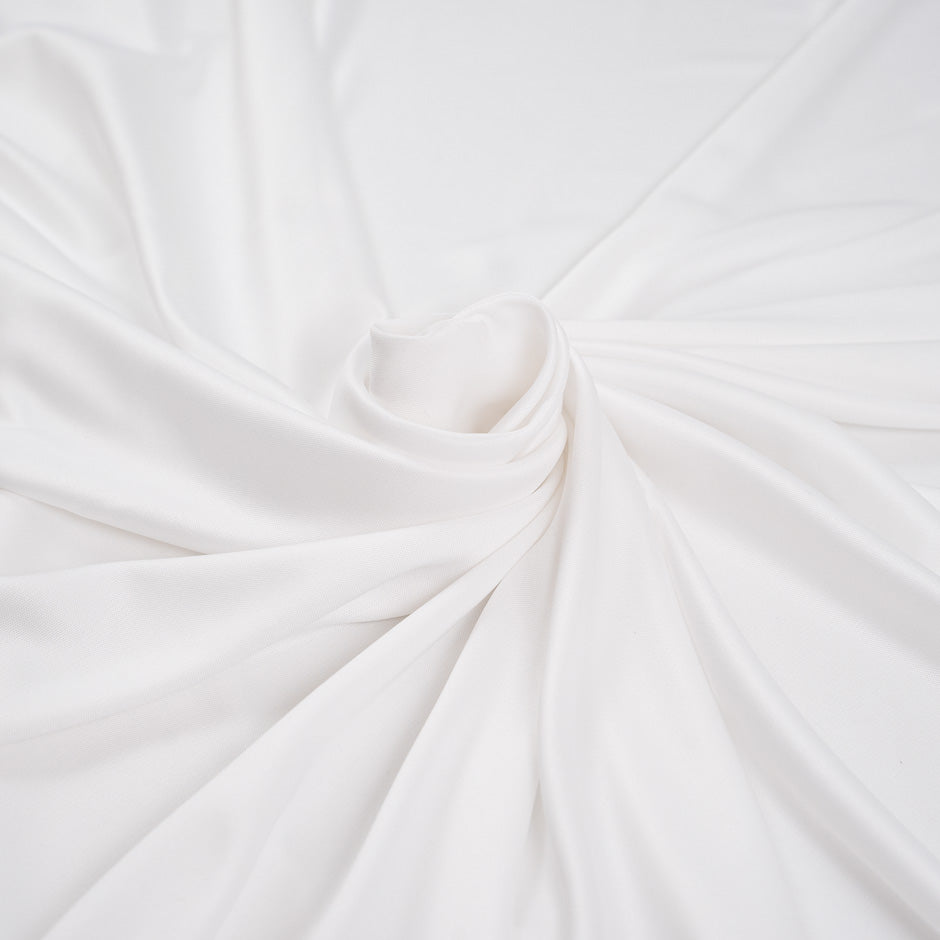 White, stretch and falling polyester jersey. High-quality deadstock fabric collected in Stock from a Maison de Couture in Italy.