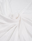 White, stretch and falling polyester jersey. High-quality deadstock fabric collected in Stock from a Maison de Couture in Italy.